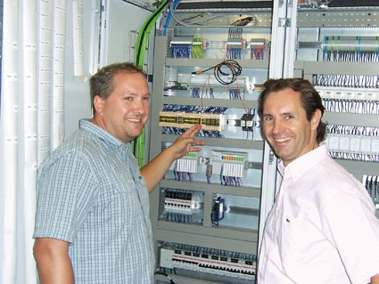 Rolf Gasser (40) and Markus Schönbächler (47) in front of the control cabinet...