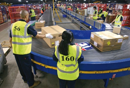 More than 1 million parcels are handled each month at APC Overnight’s sorting...