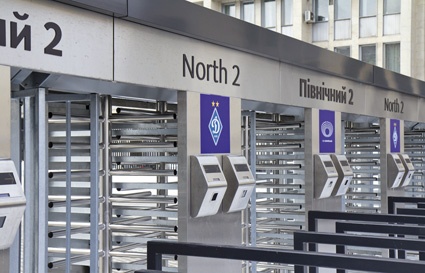 Full height turn-stiles with integrated ticket readers at the entrances.