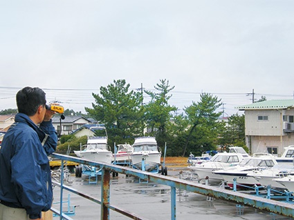 Mr. Seiya Takeda, owner of Marine Club Navy, stands guarding Fukuoka Marina