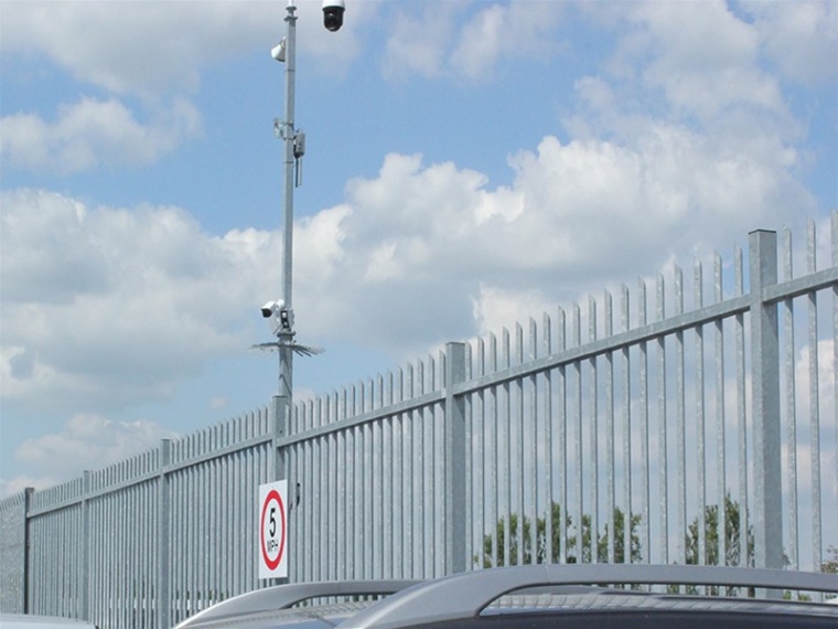Vertical bar fencing replaces steel palisade to provide perimeter security for...