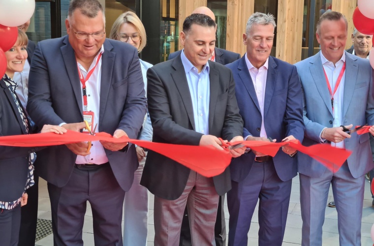 Honeywell leaders cut a red ribbon at the entrance of the new Honeywell branch in Ratingen