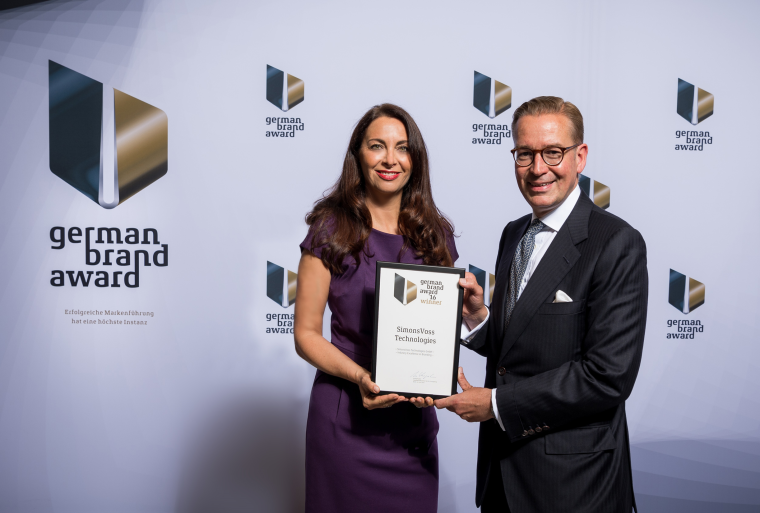 Nicole Huffer accepts a German Brand Award for Best Product and Company Brand
