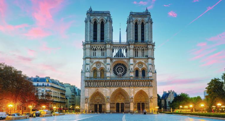 Front view of Notre-Dame Cathedral in Paris, with twin towers and a rose...
