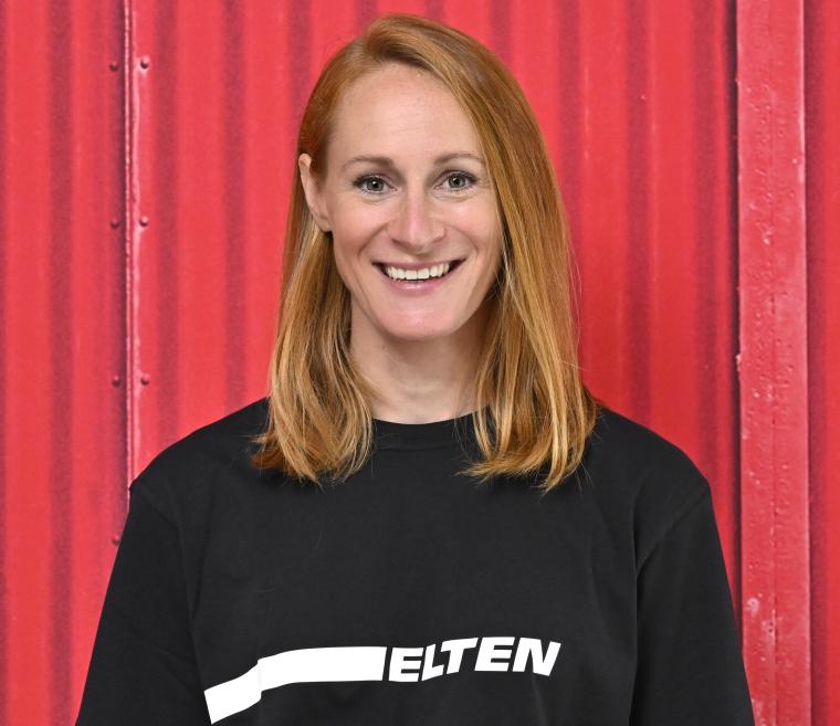 Portrait photograph of a person against a neutral background