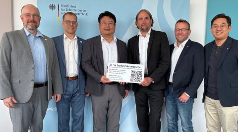 BSI IT security Label being awarded to Hanwha